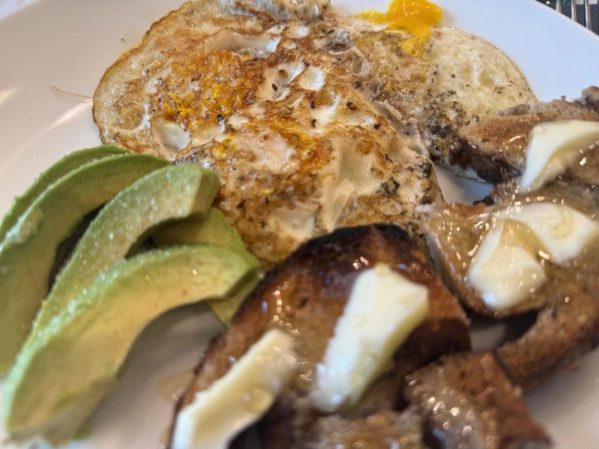 Simple clean breakfast on a sunlit kitchen table in a household mid-way through swapping products